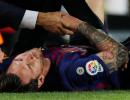 Messi injury blow as Barca go top with win over Sevilla