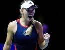 Wozniacki stays alive in Singapore; Federer survives scare