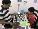 Anand celebrates International Chess Day with son