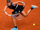 French Open PIX: Muguruza advances; Pliskova shocked