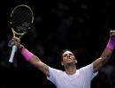 Nadal battles from brink to beat Medvedev