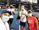 With elbow bumps, masks, World TeamTennis kicks off