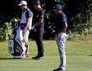 Golf makes subdued return with moment of silence