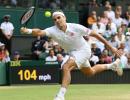 Federer roars into Wimbledon 4th round for 18th time