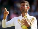 SEE: George Holds Djokovic's Trophy