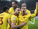 Liverpool beat Arsenal to cut City's lead; Spurs win