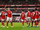 EPL PIX: Arsenal go back on top in style