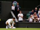 Wimbledon: Djokovic wipes slippery centre court