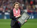 World Cup star Forlan takes up tennis racket