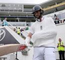 PIX: Hand in Sling, Brave Woakes Walks Out to Bat