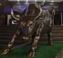 Sensex closes higher 410 pts in volatile trade