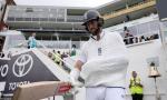 PIX: Hand in Sling, Brave Woakes Walks Out to Bat