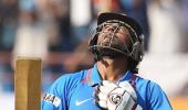 Dhoni rallies India after top-order crumbles