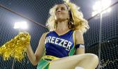 Cricket stars present, cheerleaders' present, crowd absent