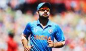 Kohli keeps wickets to give Dhoni a one-over break