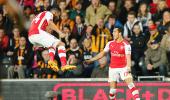 EPL PHOTOS: Arsenal coast past Hull, close in on Champions League berth