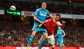 EPL PHOTOS: Sunderland eke out draw at Arsenal, avoid relegation threat