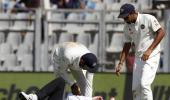 Umpire Reiffel leaves the field after being hit by ball