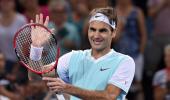 Federer battles past Dimitrov, Azarenka sails into final