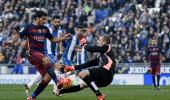 Espanyol put brakes on Barca, Atletico go top