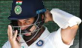 Why does Pujara usually not respond to criticism