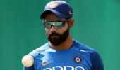 SEE: Determined Jadeja trains in the rain