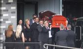 Family, friends say goodbye to Warne at private funeral