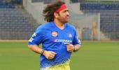 Dhoni Unveils Retro Look: Back to Long Hair, Bandanas