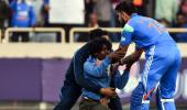 Drama as fan breaches security to touch Kohli's feet!