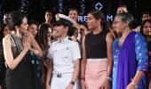 What's Karisma doing with naval officer Pooja Sharma?