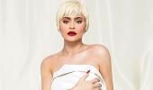 Kylie Jenner poses in a bedsheet