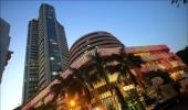 Sensex trims initial gains