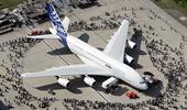 Airbus to cut output, foresees tough times