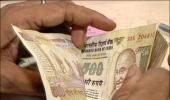 Rupee gains 20 paise to end at 55.11 vs USD