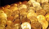 Gold glitters with second biggest gain in 2011; up by Rs 1,025