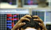 Weak rupee, global growth worries drag Sensex lower