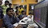 Markets end flat as auto, oil stocks decline