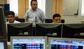 Markets end down dragged by metal, banks