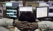 Markets end flat amid volatile trade