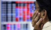 Markets end flat on global cues