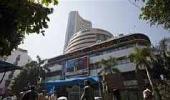 Choppy markets end firm, RBI keeps rates steady