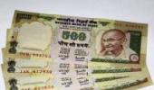 Rupee weakens by 48 paise to close at 54.97