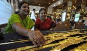 Gold tumbles by Rs 360, silver by Rs 550