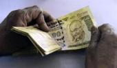 Rupee slumps to over 1-mnth low at 54.80; down 55 paise Vs USD