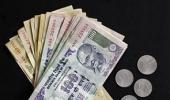 Rupee gives up early gains, ends four paise down at 61.27