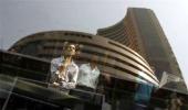 Sensex pares earlier gains; banks under pressure, metals shine