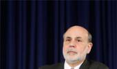 In Bernanke's final act, Fed cuts stimulus despite market turmoil