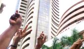 Market ends at record highs; Sensex tops 25,000