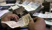 Rupee trims initial gains, still up by 14 paise vs dollar