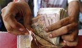 Rupee gains on corporate dollar sales; remains in tight band